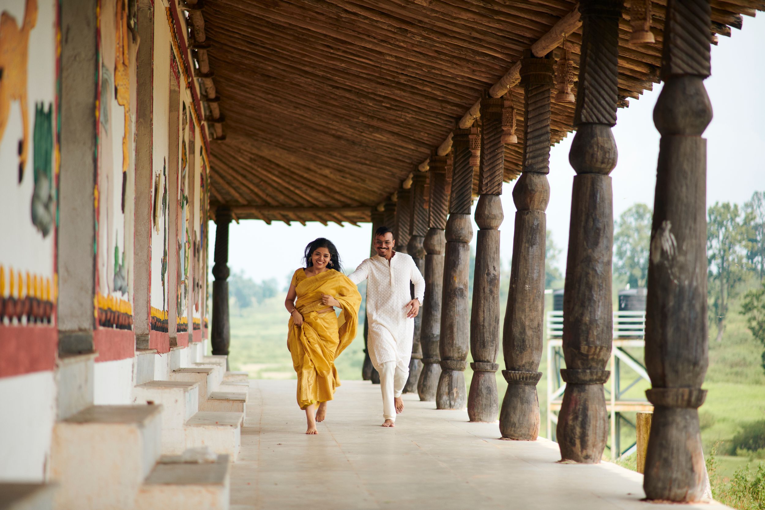 A couple standing close under surrounded in a romantic and intimate moment.
