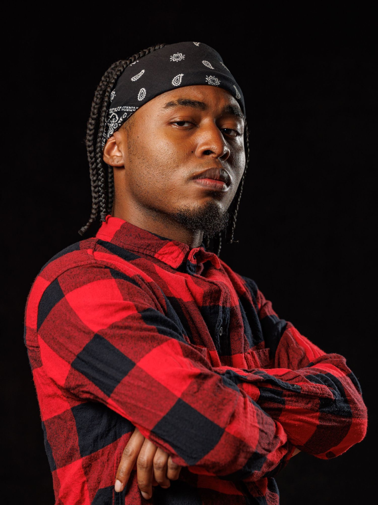 A photo of an actor having his headshot taken for a movie director to review