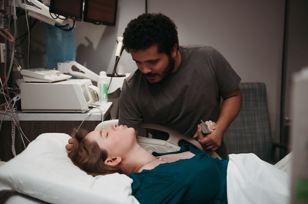 Husband comforts wife in labor.