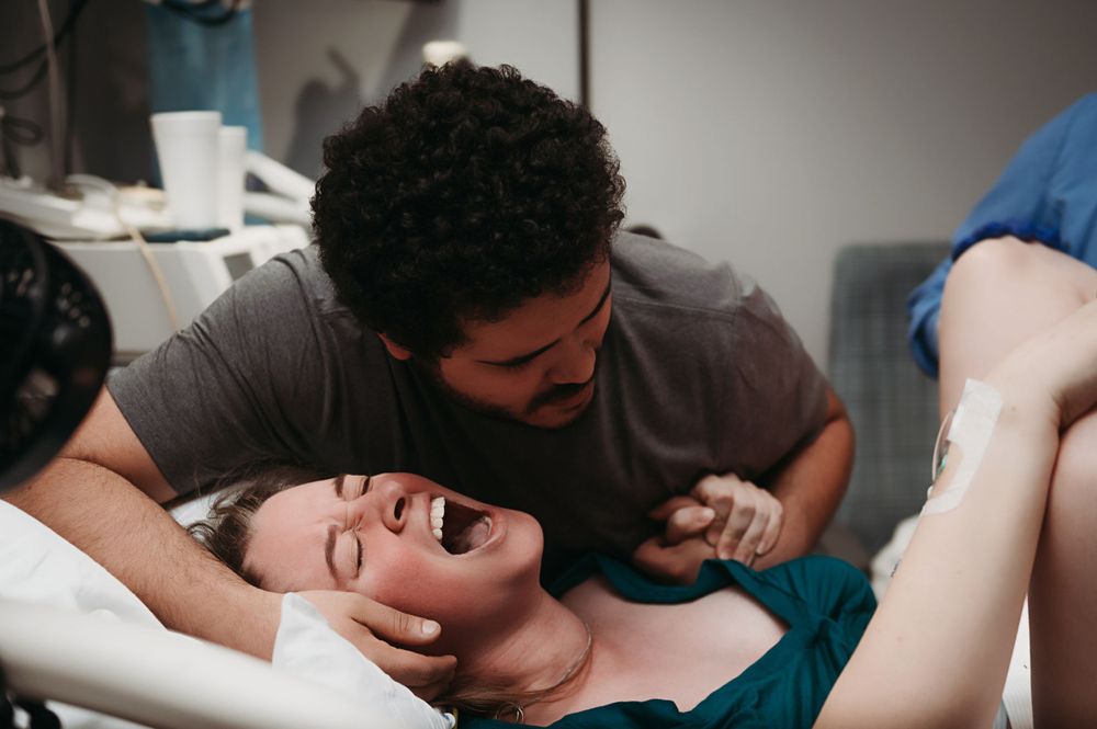 Woman giving birth.