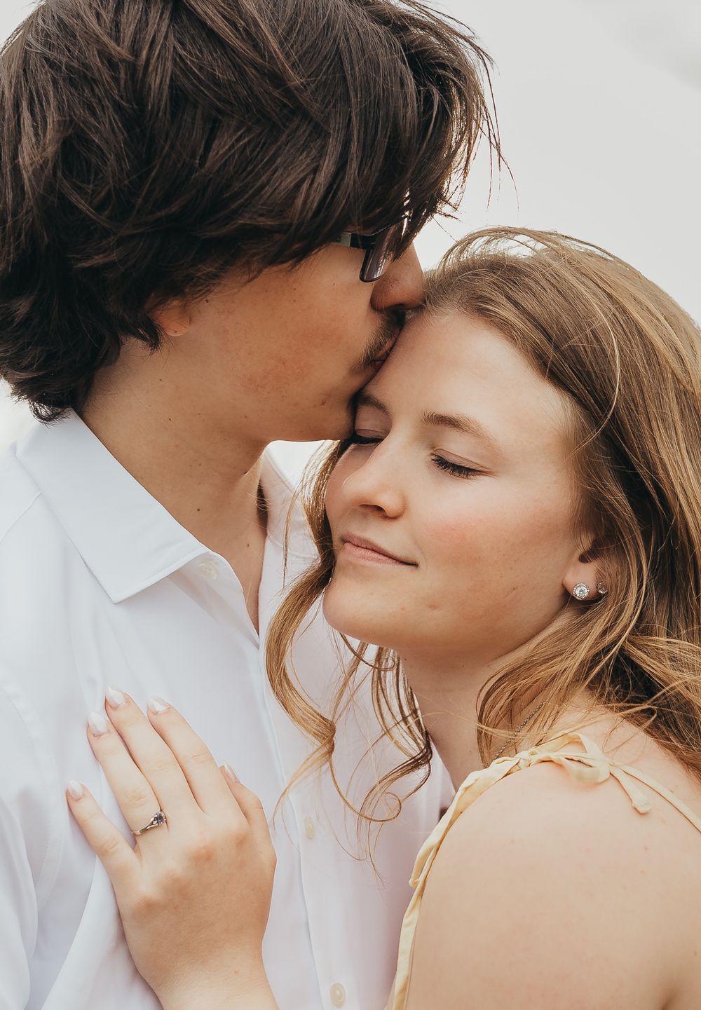 couple windy him kissing her temple
