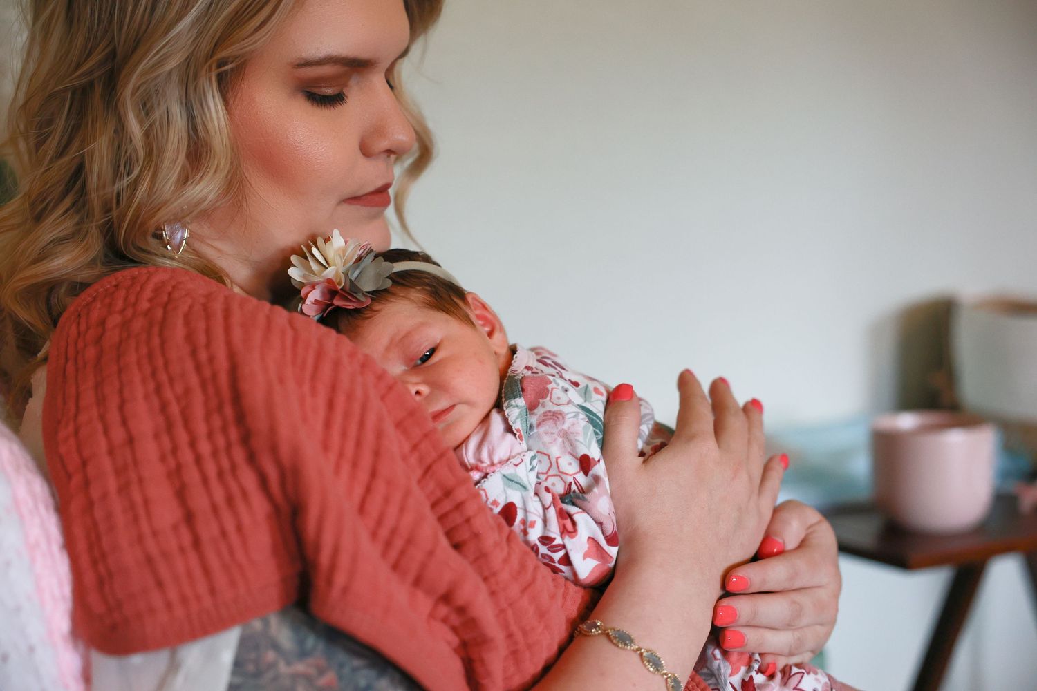 A tender moment as someone holds a sleeping newborn baby Carlsbad Roswell Artesia Hobbs New Mexico NM lifestyle in home newborn pictures