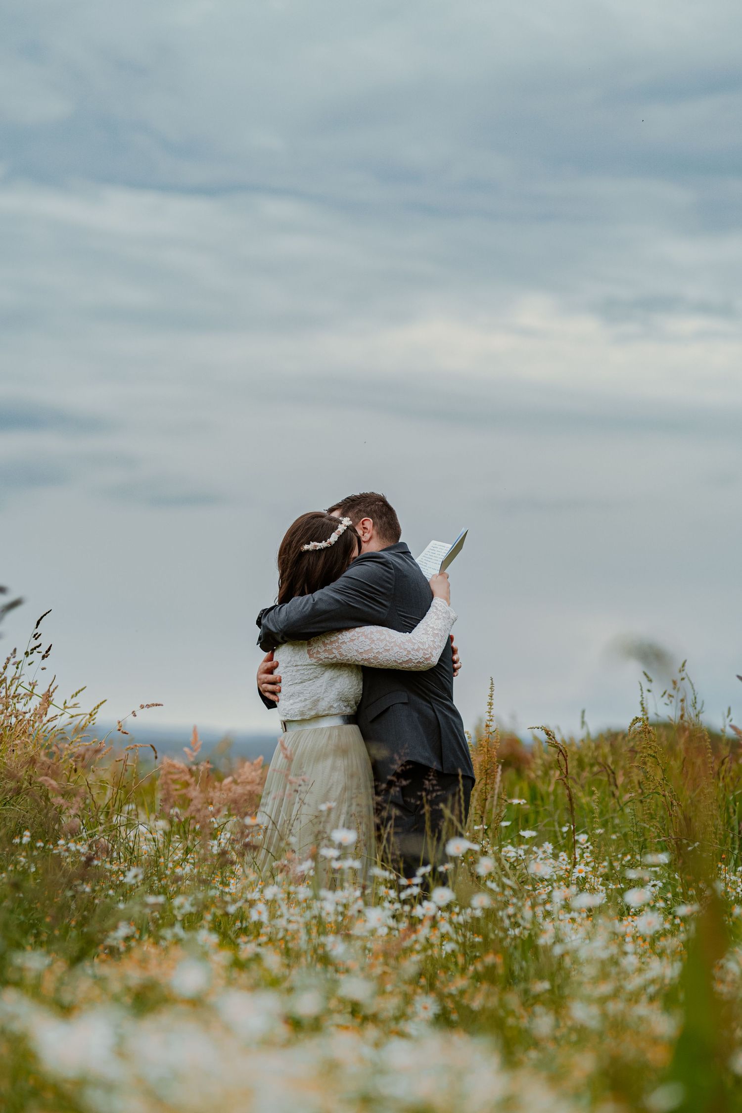 A romantic couple shares intimate moments in a series of tender close-up shots wearing cream colored sweaters.