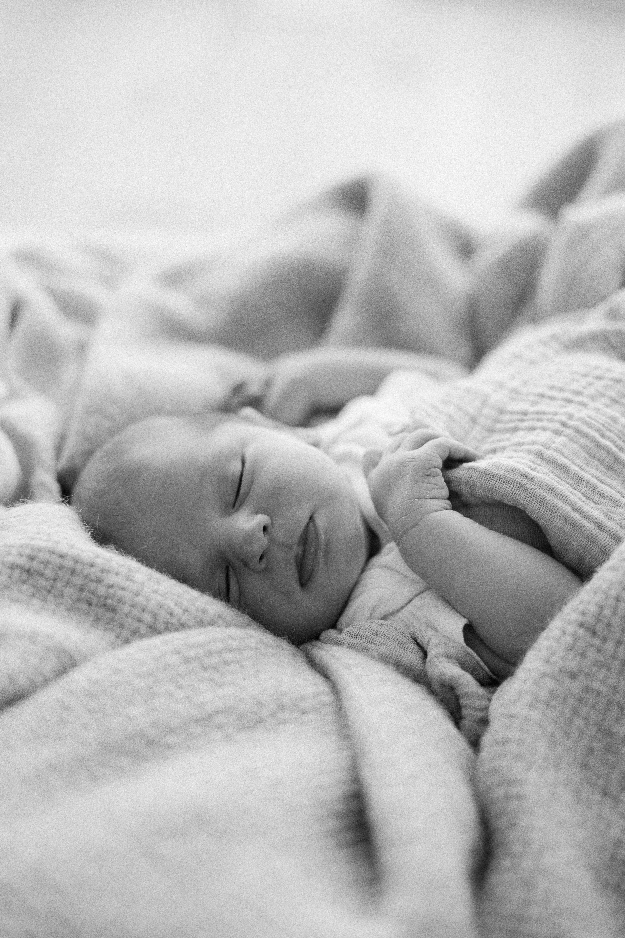 Newborn studio photography in Orange County capturing candid moments