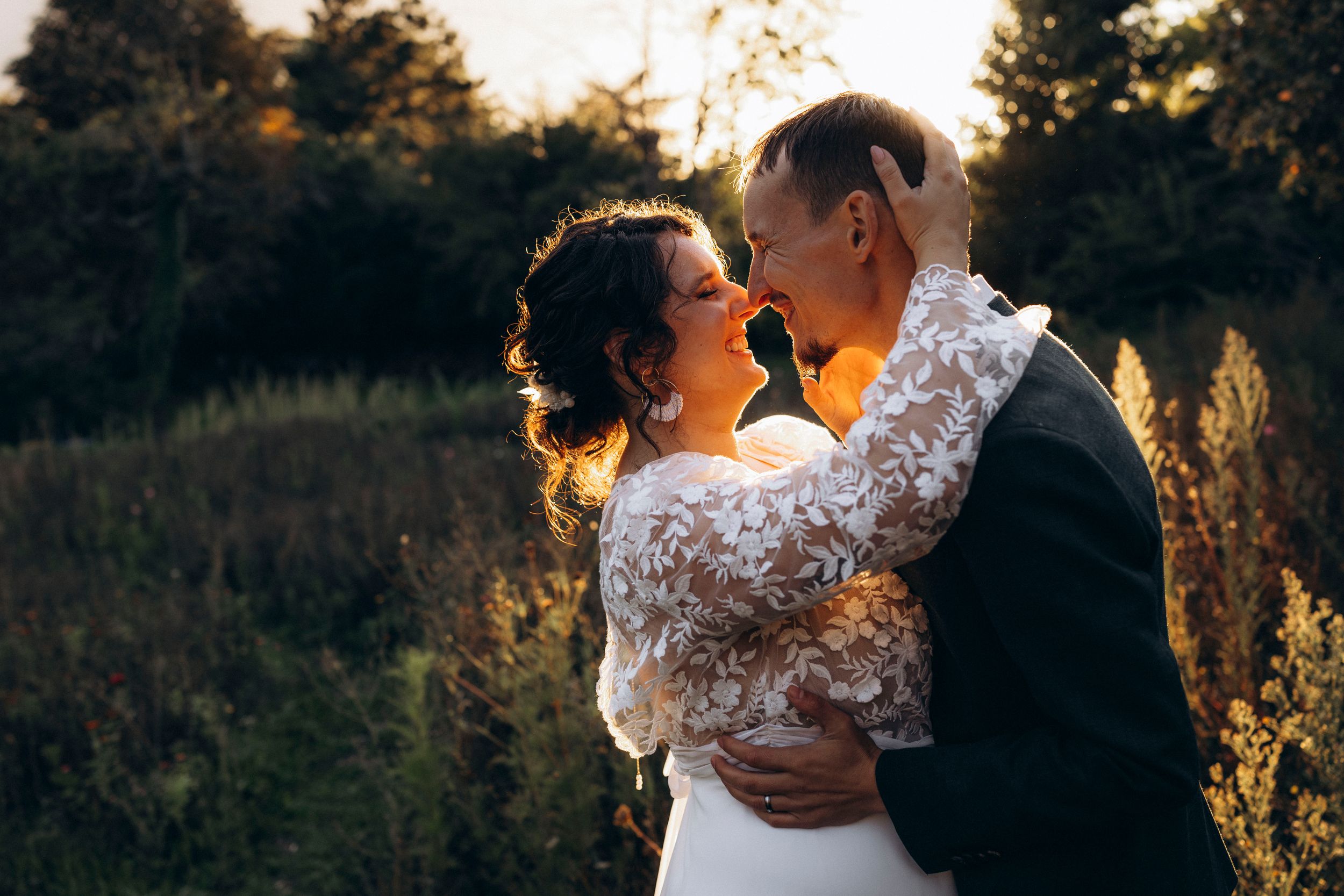 A romantic dance silhouette under stone archways with warm lighting.