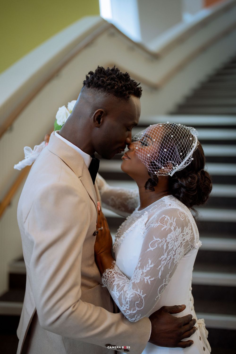 A romantic sequence of wedding photos shows a couple sharing intimate moments on a staircase in formal attire.