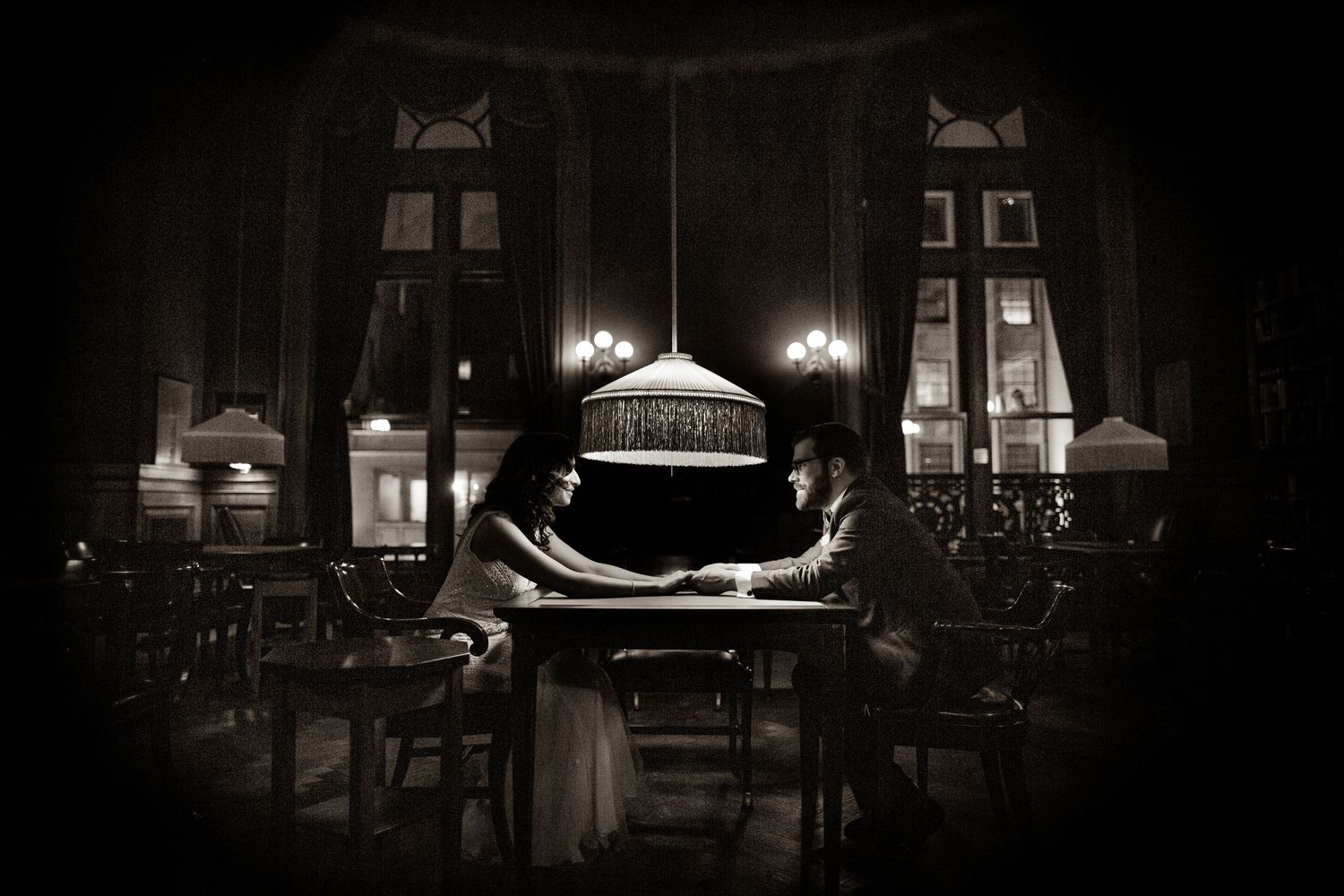 A dramatic black and white photo series shows a casket in a dimly lit funeral home interior.