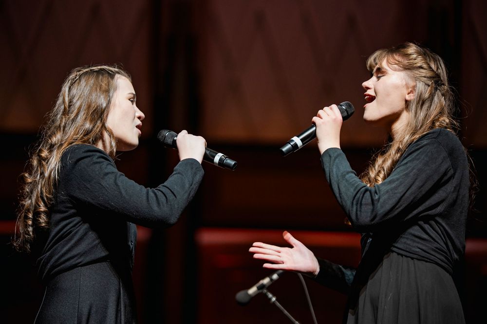 Two Girls singing together