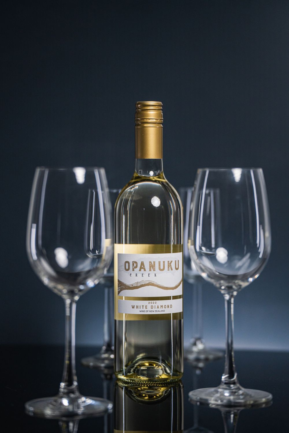 Professional Auckland product photography showcasing premium wine bottles and glasses, captured by a commercial photographer in New Zealand.