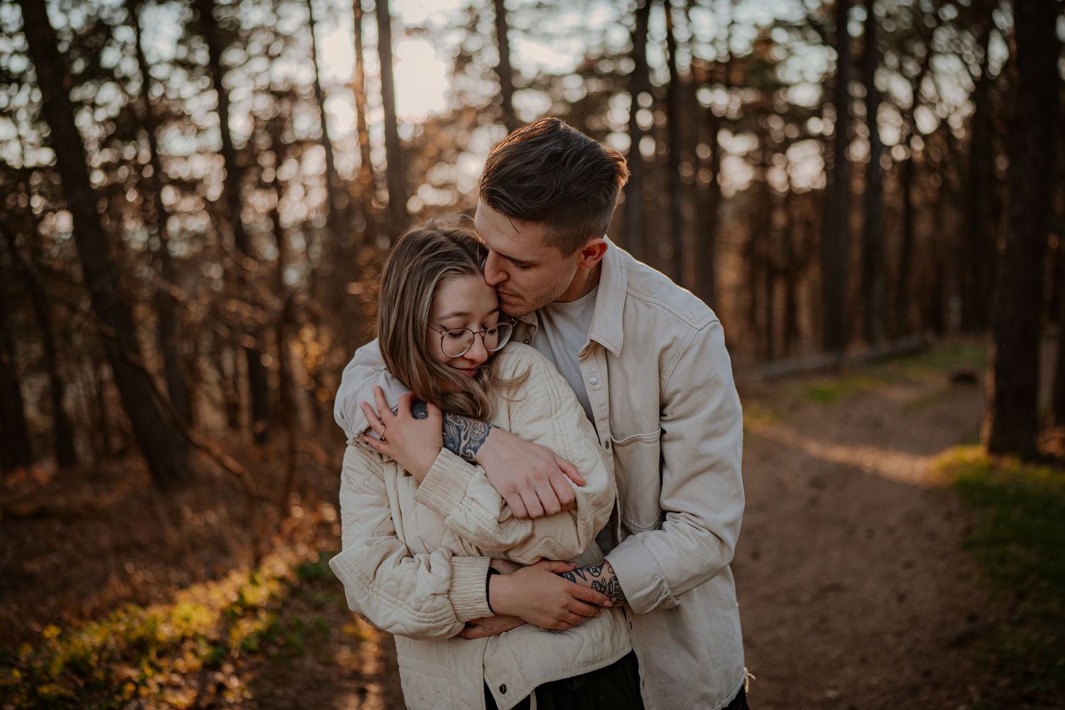 A romantic couple shares intimate moments in a series of tender close-up shots wearing cream colored sweaters.