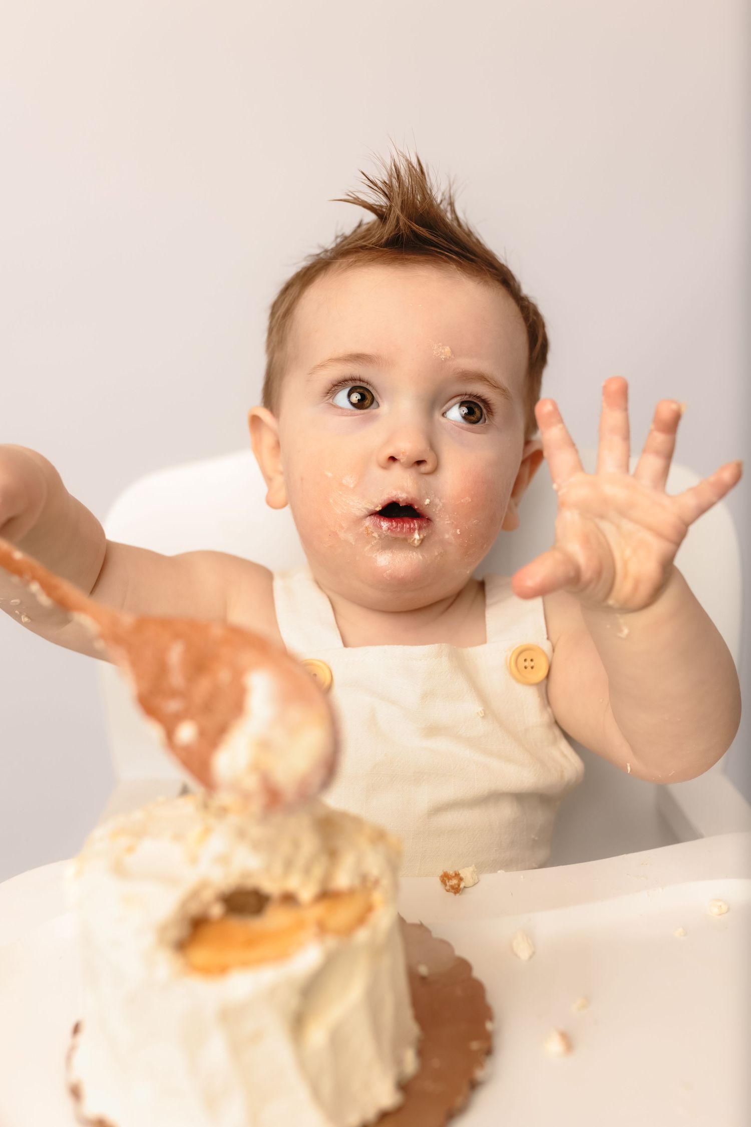 Baby boy messy boho first birthday cake smash session in Charlottesville, Virginia