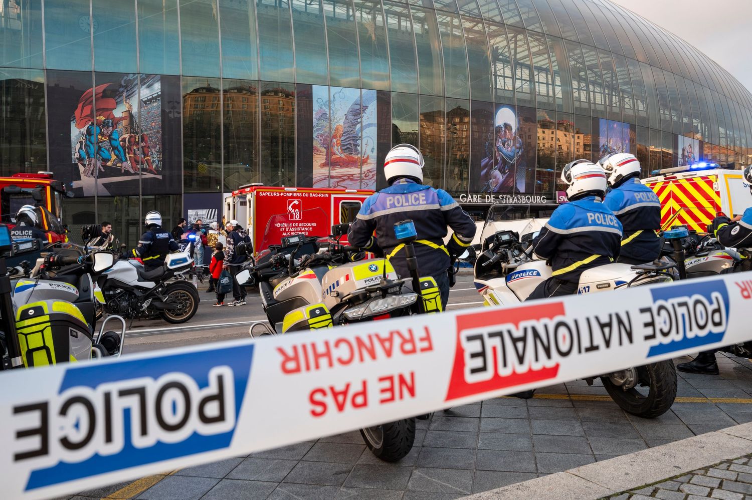 Police tape and emergency vehicles are gathered outside the Strasbourg central station.
