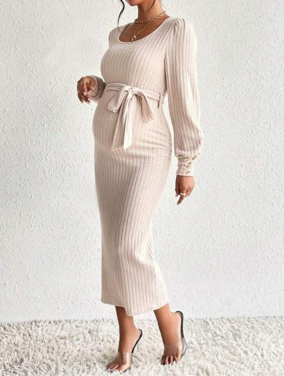 Maternity fashion shoot featuring a ribbed cream-colored dress.