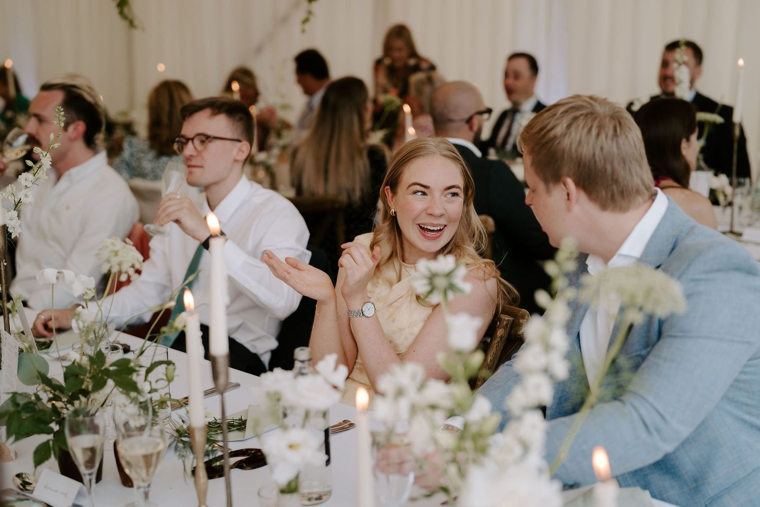wedding guests talking and laughing during meal at hamswell house wedding in bath