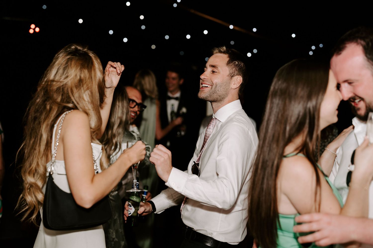 wedding guests dancing on dance floor at hamswell house wedding in bath