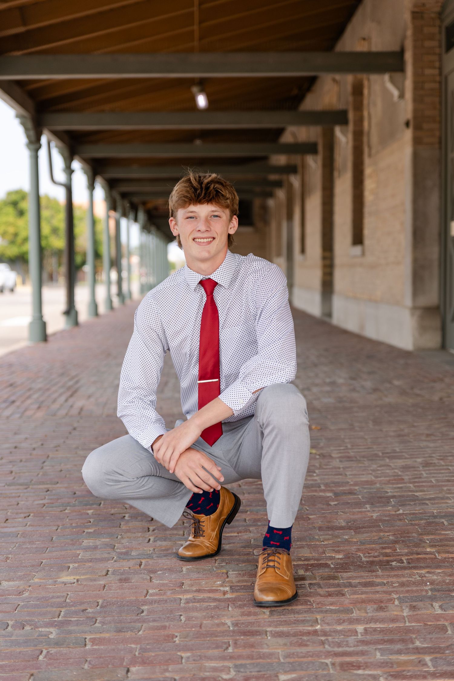 becky katzberg photography senior boy in shirt and tie at the train station