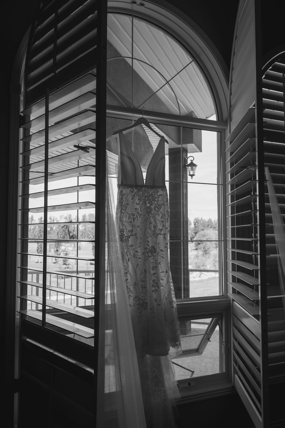 Black and white architectural photos showing windows with curtains and shutters in an elegant interior space.