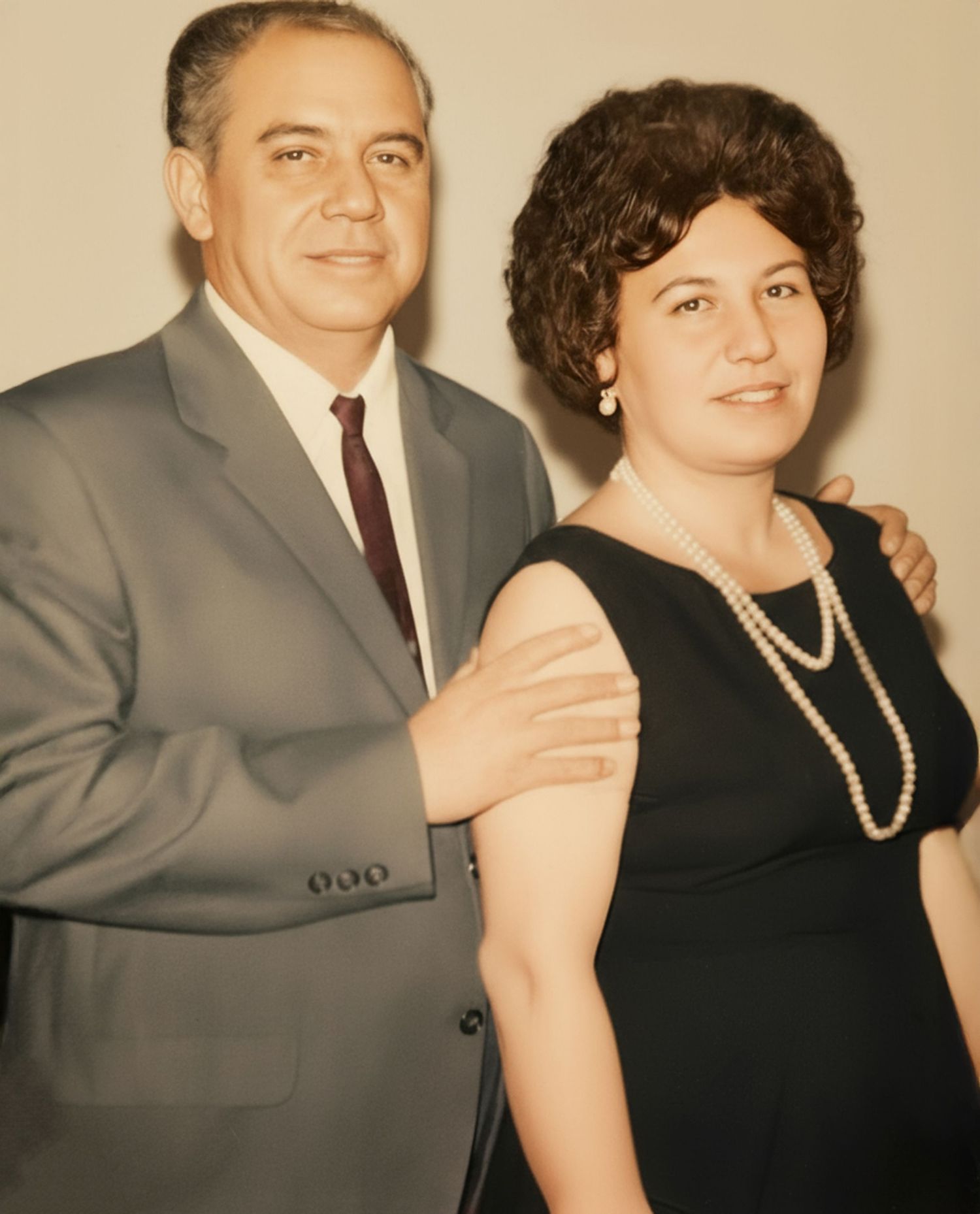 A couple in formal attire pose together at a vintage photo session, with the image repeated in multiple frames.