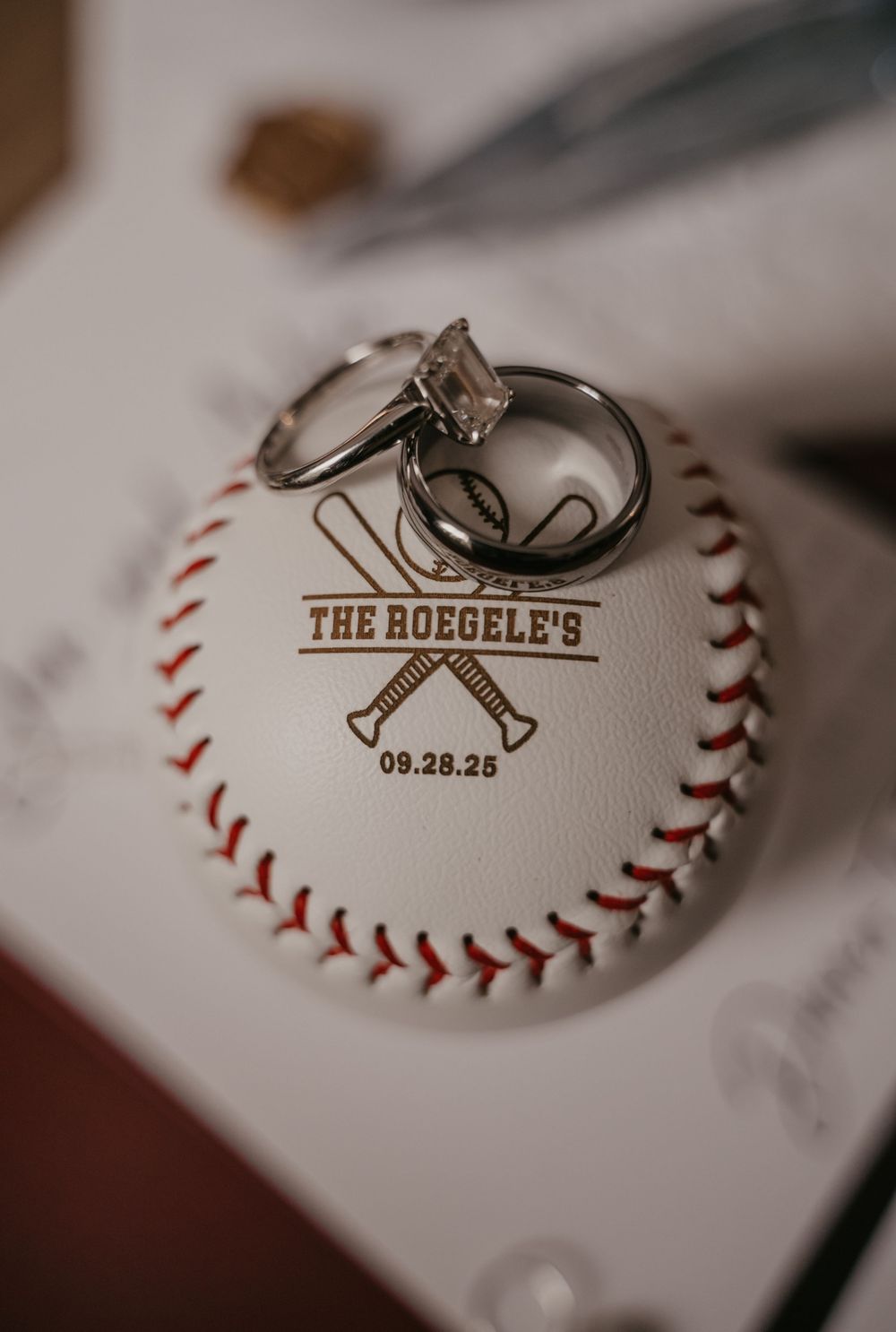 Custom printed baseballs with crossed bats logo and wedding date serve as unique keepsake favors.