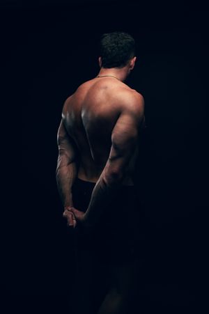 Utah male boudoir and fitness photography by Carl James Photography in Salt Lake City, masculine posing and professional studio lighting.