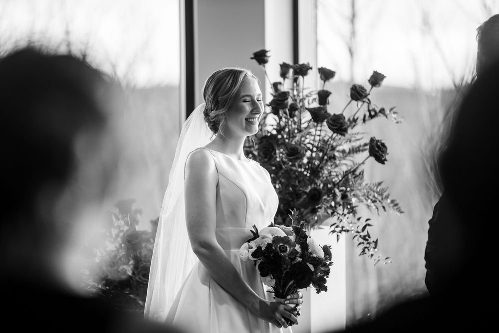 A series of romantic black and white wedding photos showing silhouettes and floral arrangements in soft light.