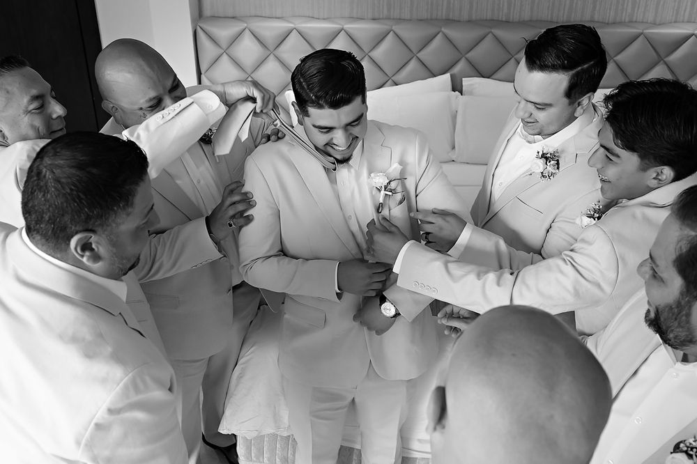 Getting-ready portraits of the bride and groom at Moon Palace before the beach ceremony.