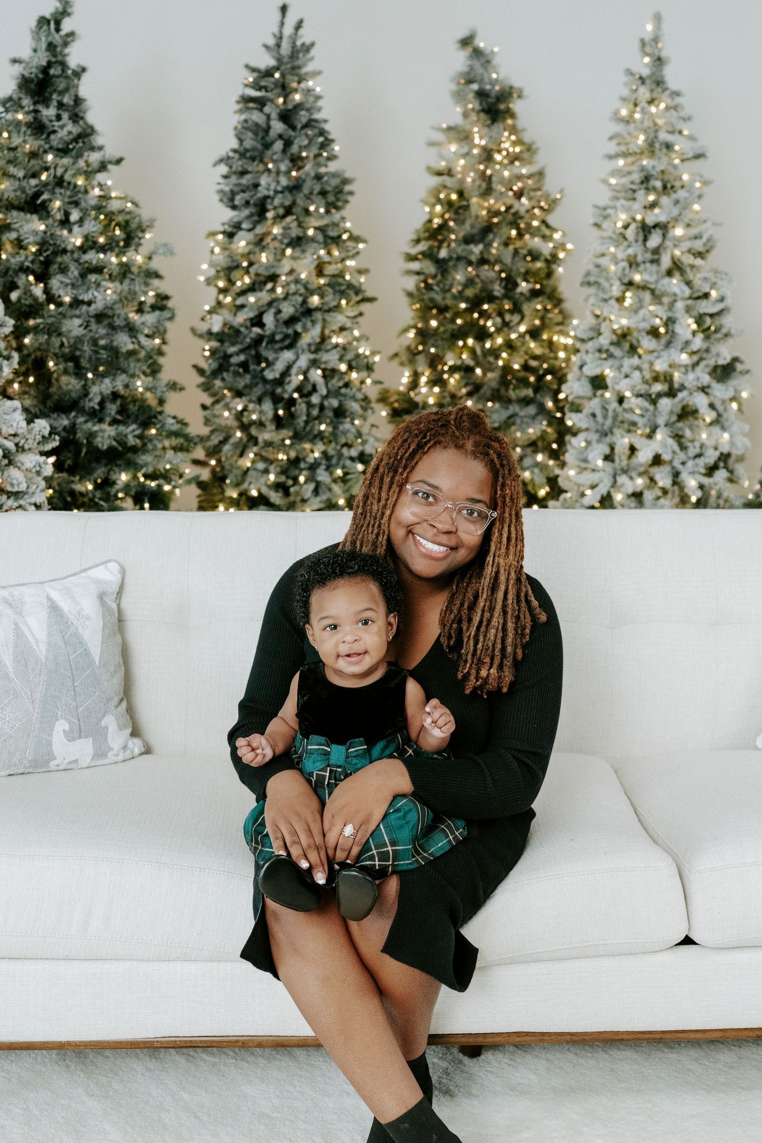 A series of festive holiday photos with decorated Christmas trees and a white couch setting creating a cozy atmosphere.