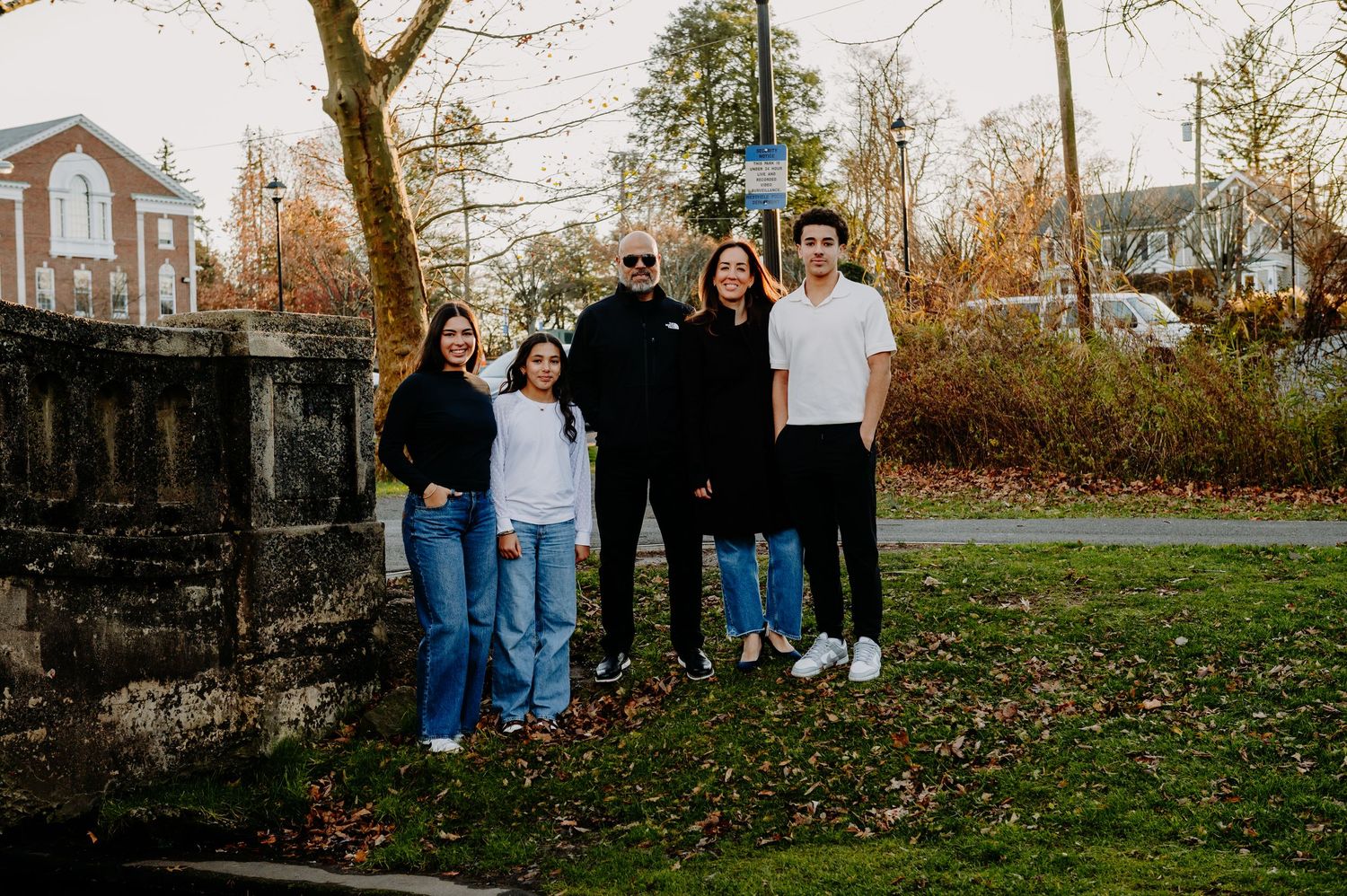 Family walking together through a park in the winter time in New Jersey. Family Sessions in New Jersey. Outdoor family photographer.