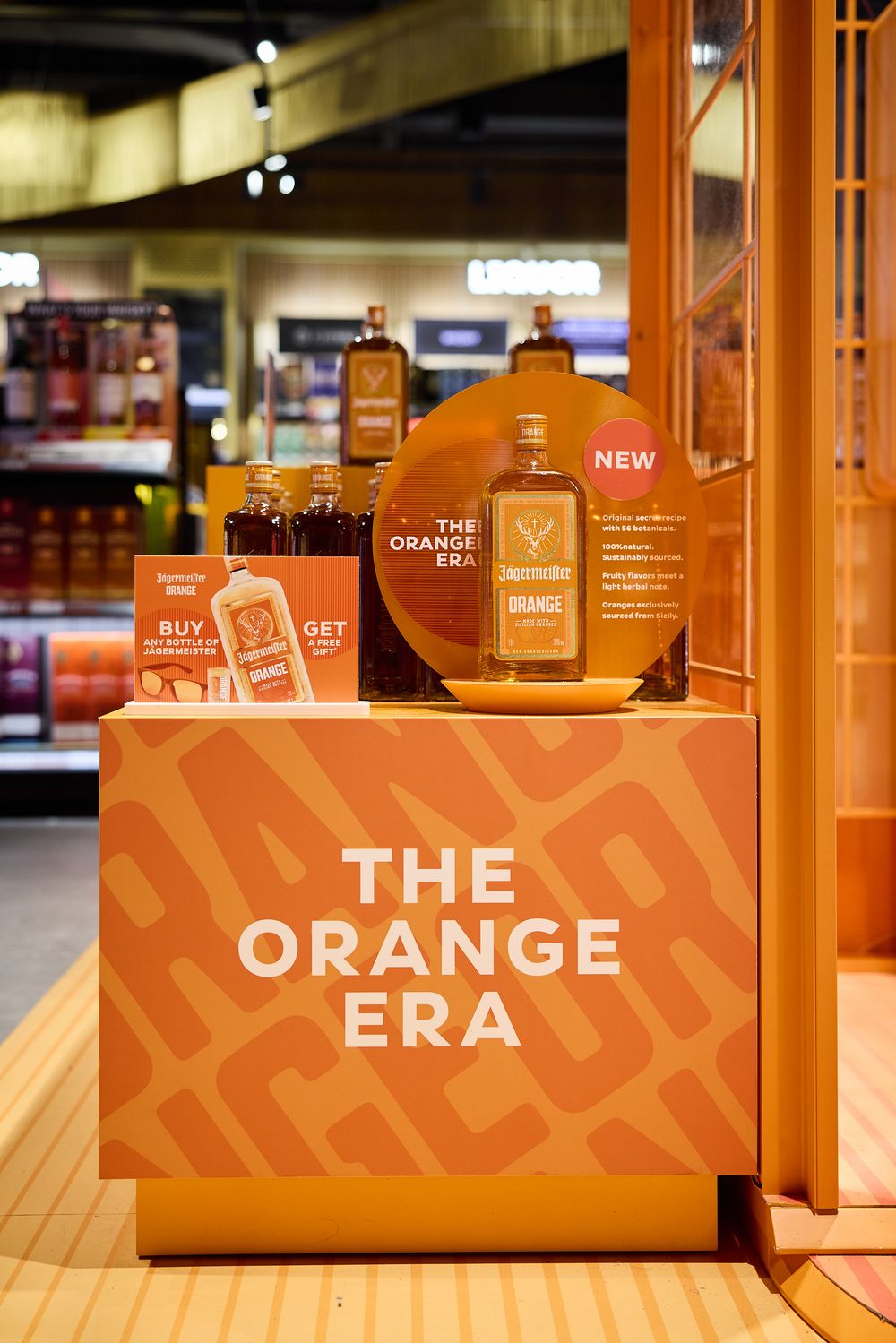 Travel retail airport activation photography for Jagermeister Orange in Spain at Alicante Avolta duty free store