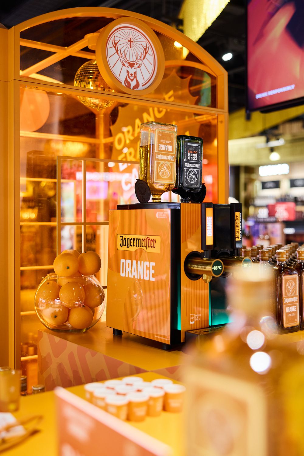 Travel retail airport promotion photography for Jagermeister Orange in Spain at Alicante Airport Avolta duty free store