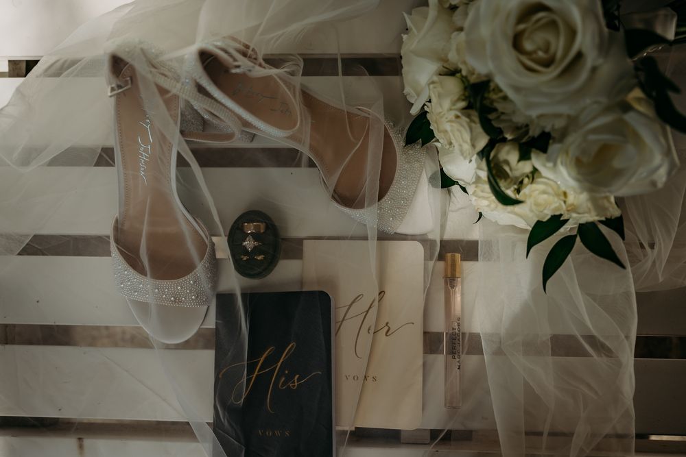 Elegant white roses and delicate floral arrangements create a romantic wedding day atmosphere.