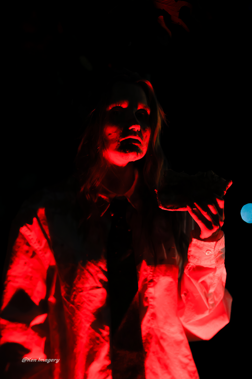 Artistic sequence of dark photos with dramatic red lighting creating an ethereal glowing effect against black background.
