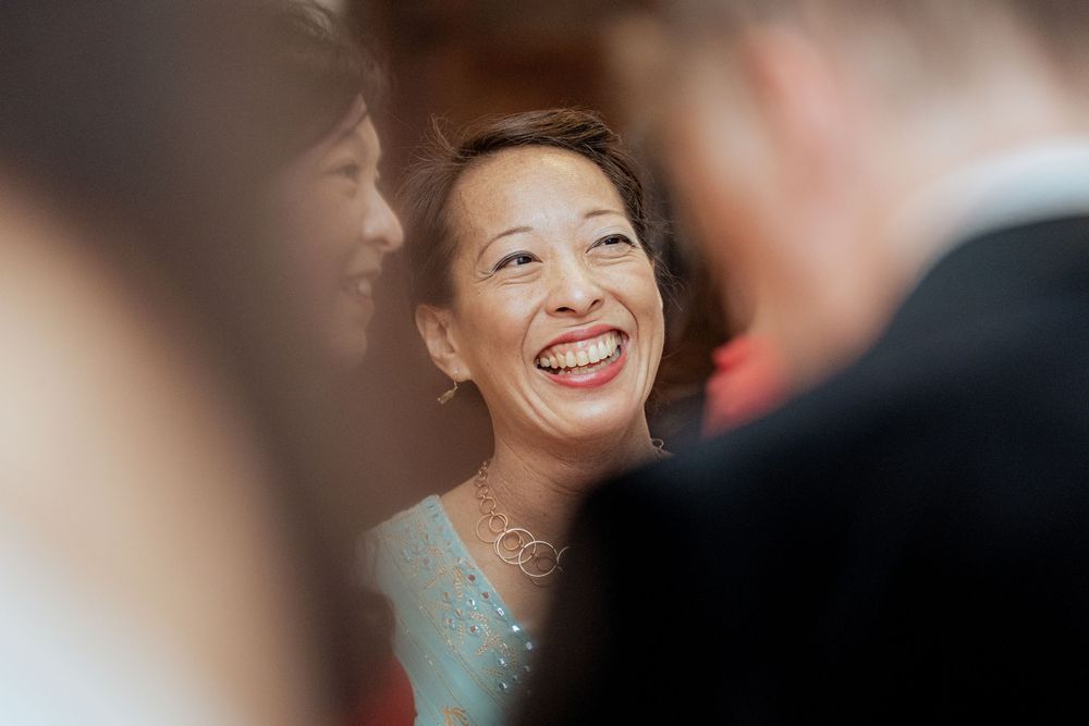 A couple sharing a joyful moment while dancing at a formal event.