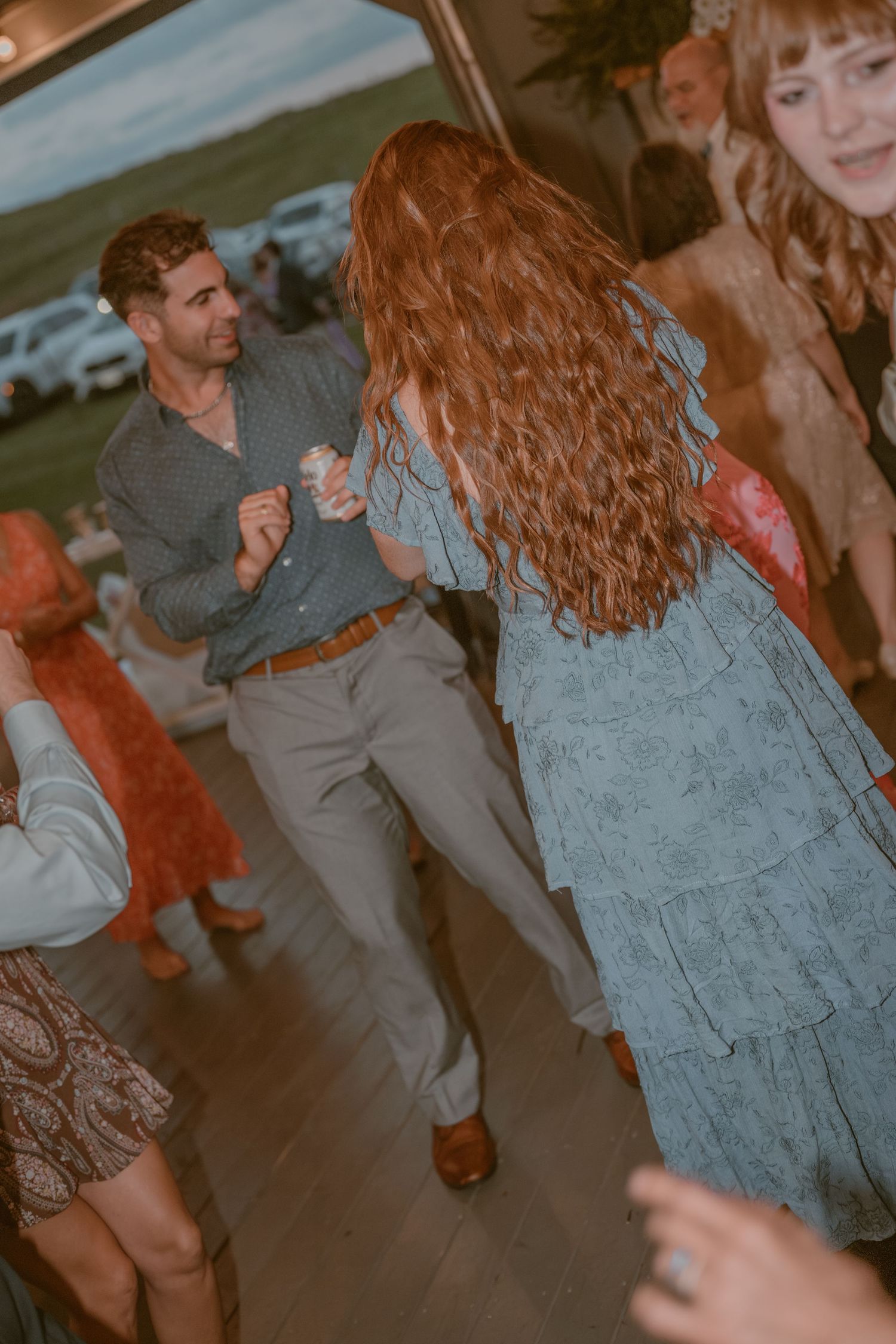 Guests dancing and celebrating at Gaie Lea, Staunton, VA, with bride and groom sharing intimate moments, candid style.