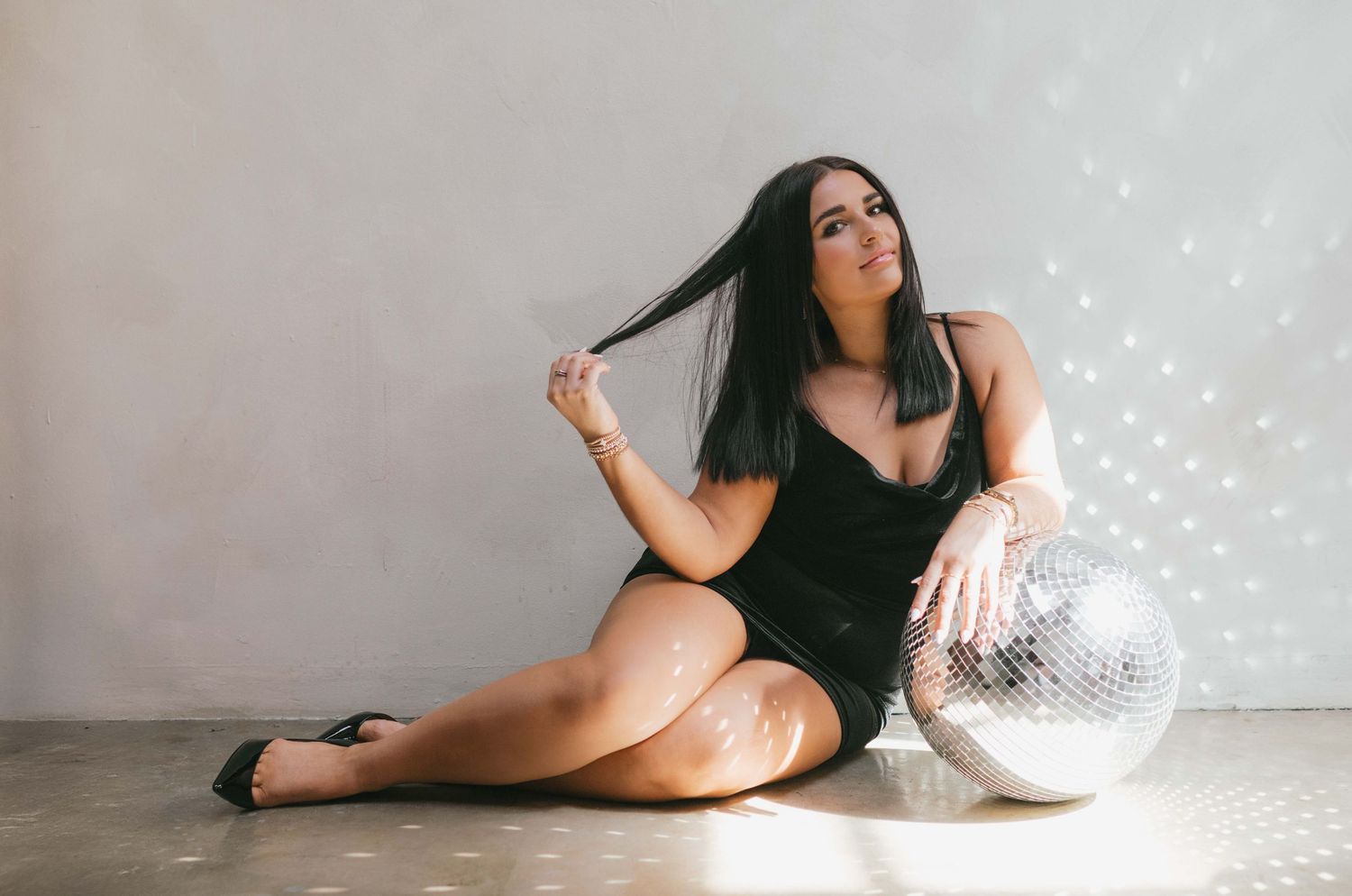Studio portrait session with sparkly lights and dreamy atmosphere.