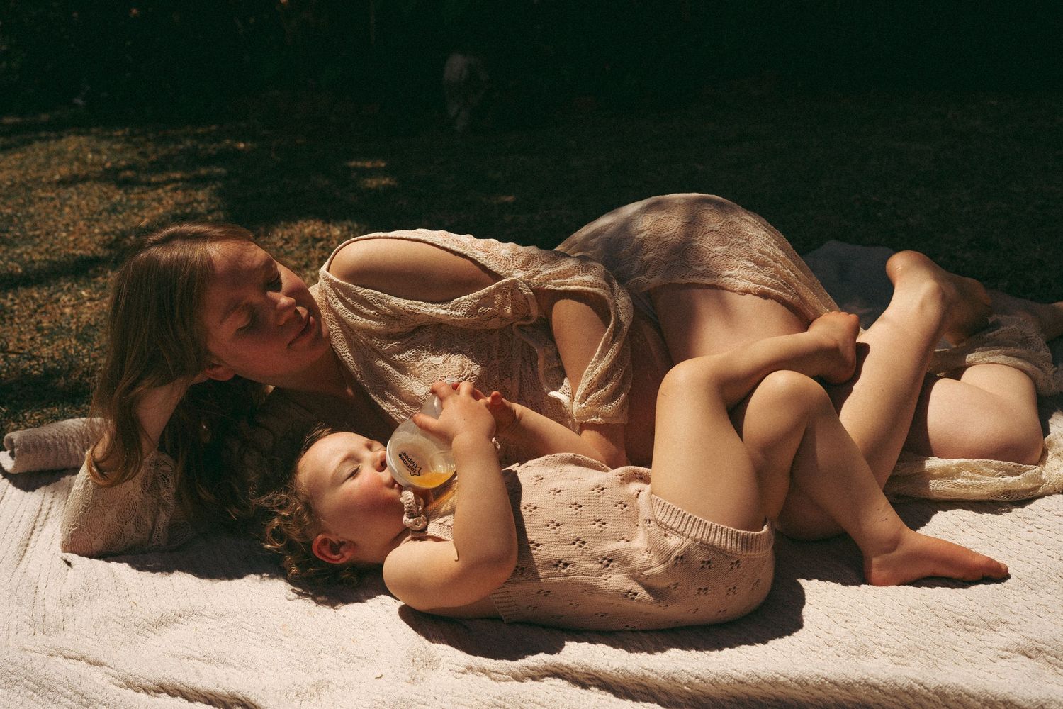 Intimate outdoor portrait showing affection between parent and child.