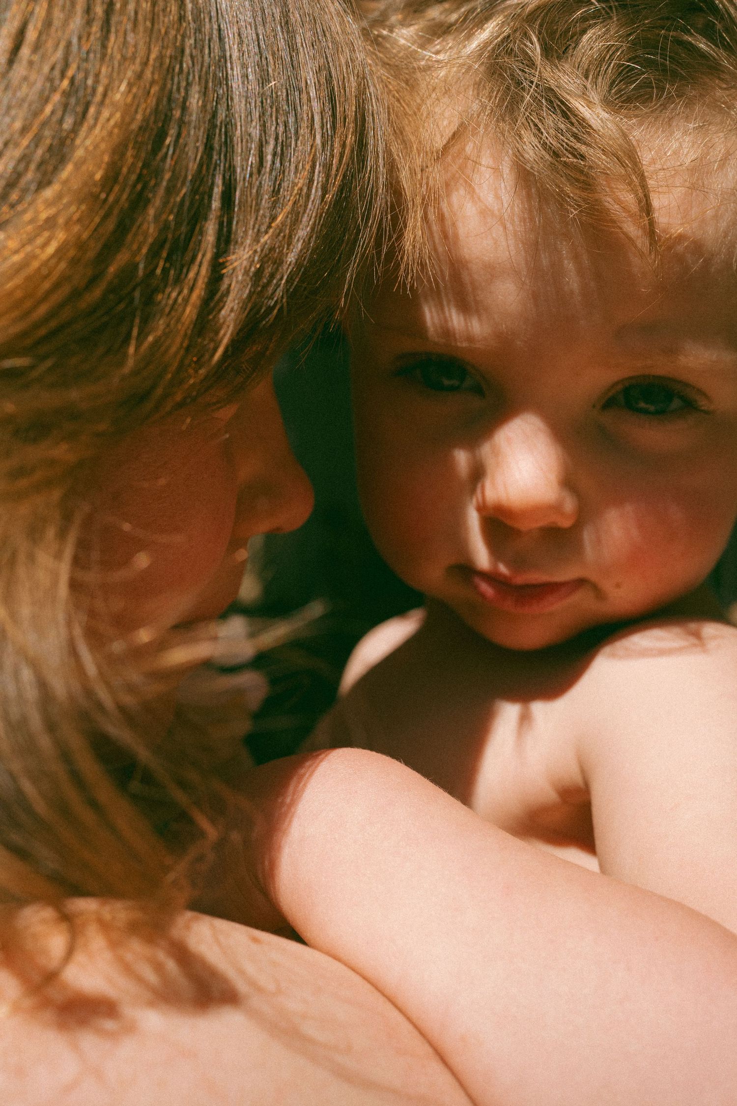 Intimate close-up portrait with warm lighting and soft focus.