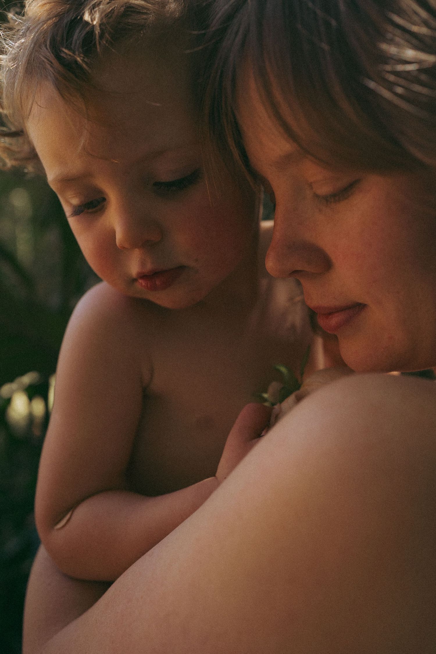Intimate close-up portrait showing gentle moment of connection.