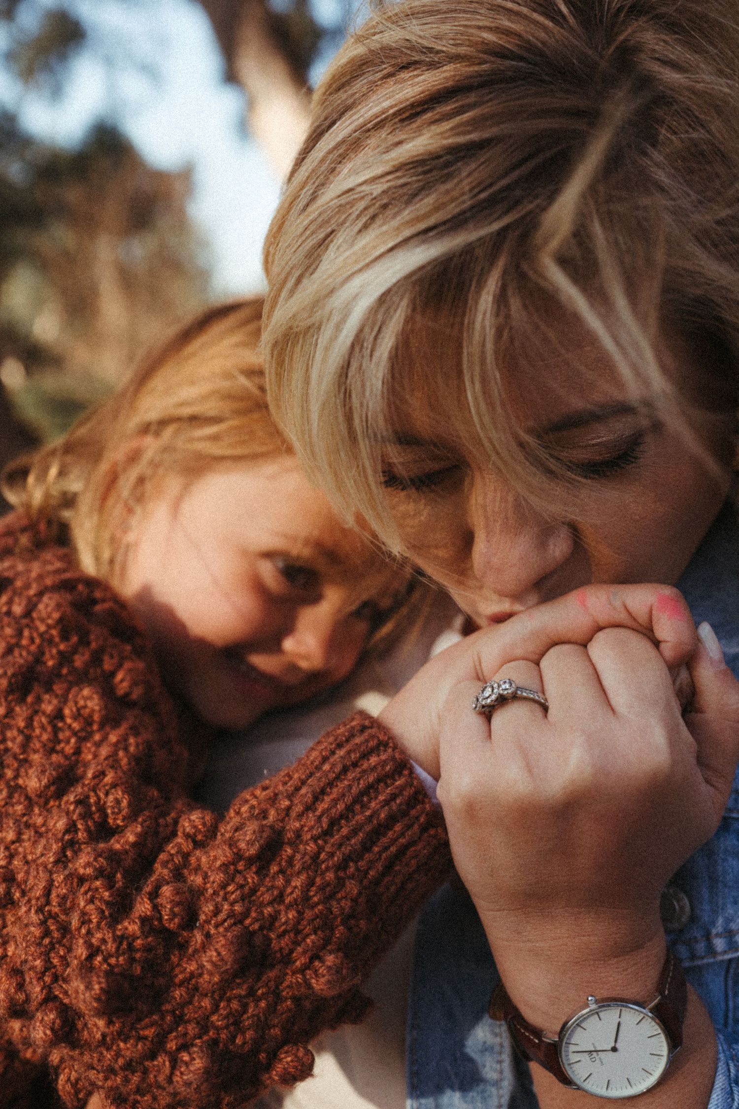 Intimate close-up portraits showing tender moments between two people outdoors.