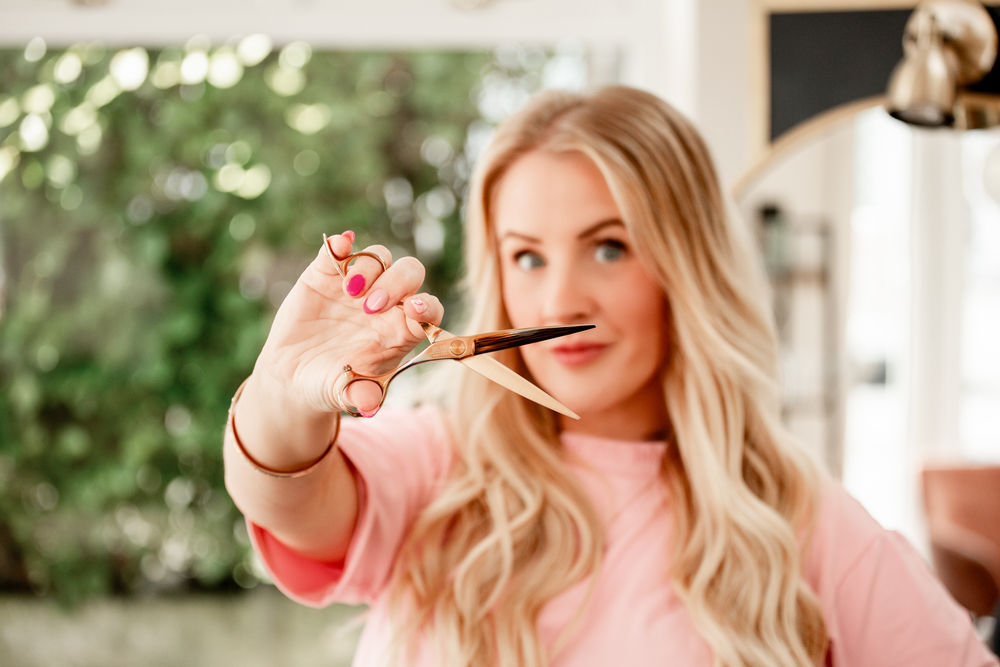 Lifestyle photography featuring pink clothing and natural expressions.Salon Branding Photography in St Austell, Cornwall - Caribou