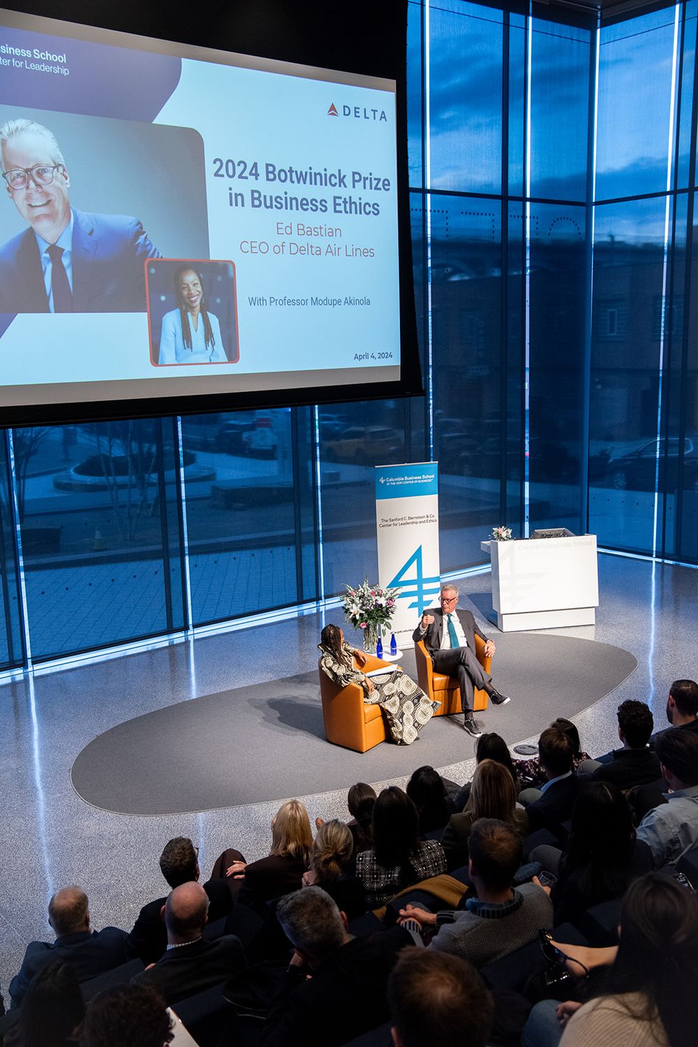Conference presentation at the 2024 Botwinick Prize in Business Ethics event with audience members watching speakers on stage.