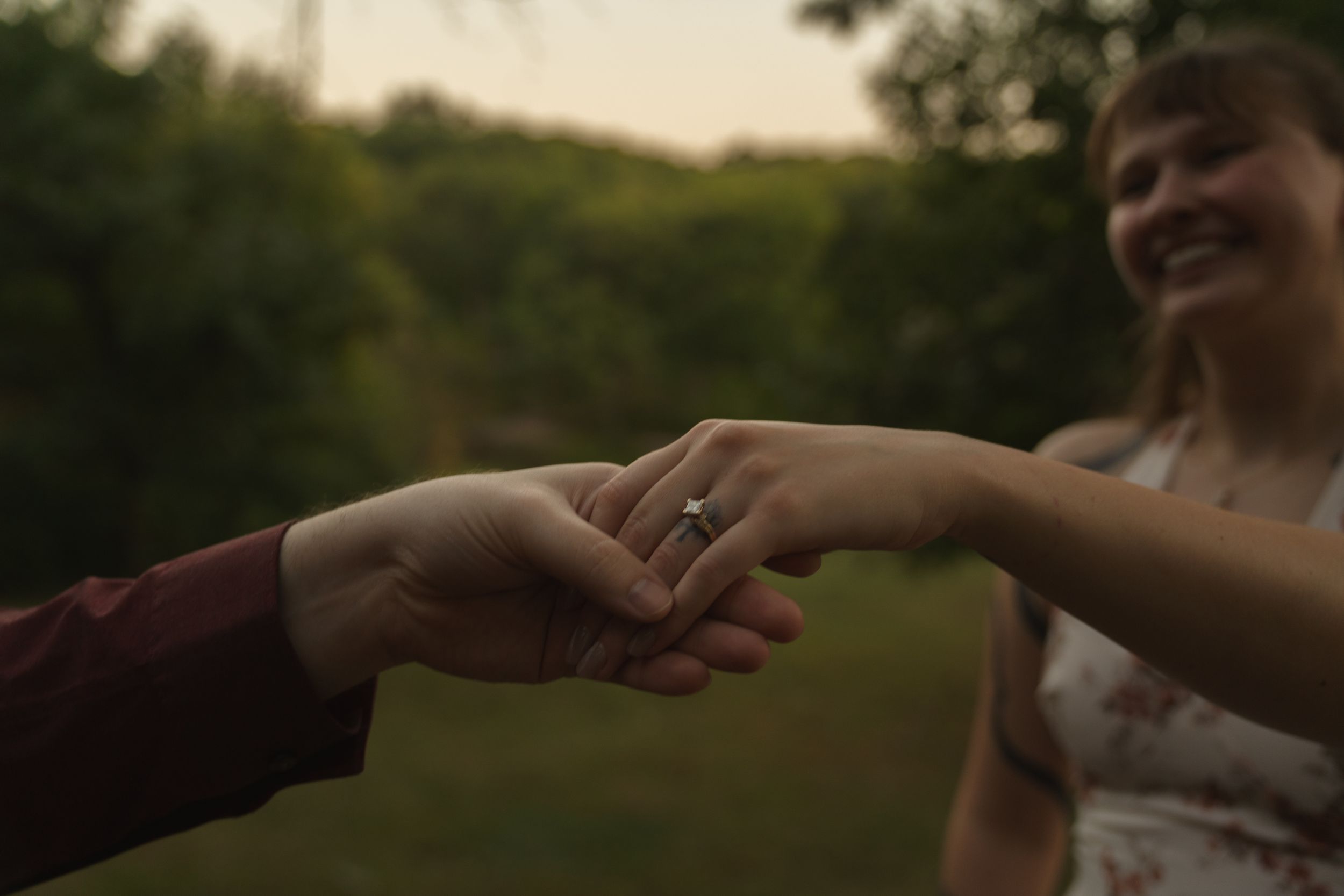 Romantic sunset scene in a natural outdoor setting during golden hour.