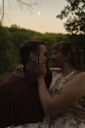 Tender embrace between couple during golden hour photography session.