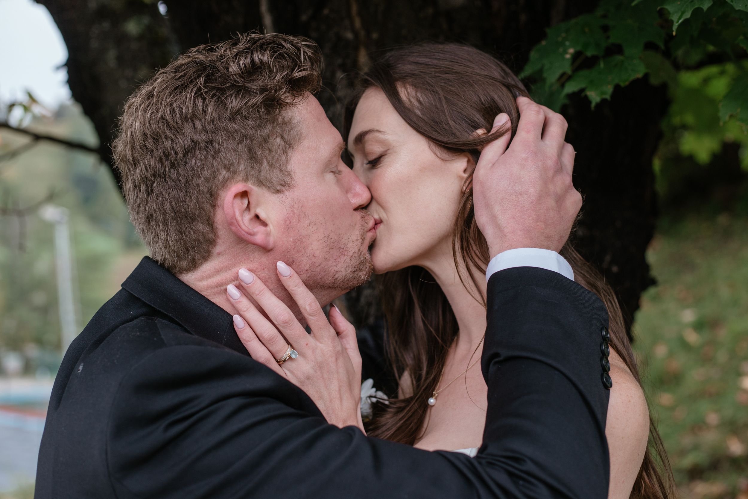 Series of romantic outdoor photos showing a couple kissing in a garden setting.