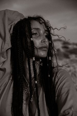 Black and white portrait series with dramatic lighting and flowing hair.