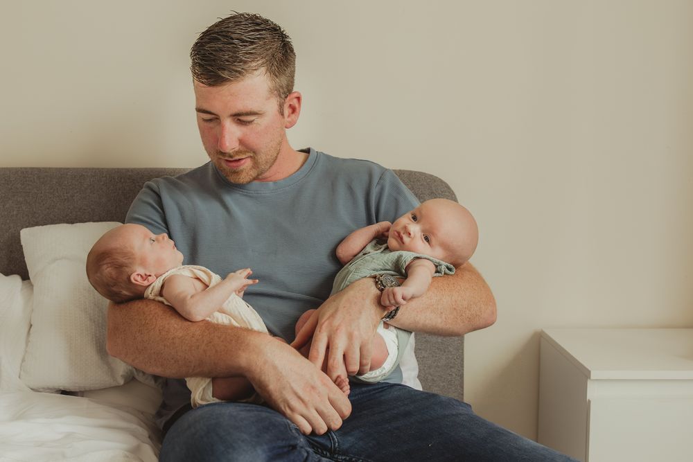 A series of candid shots showing tender moments between a parent and newborn.
