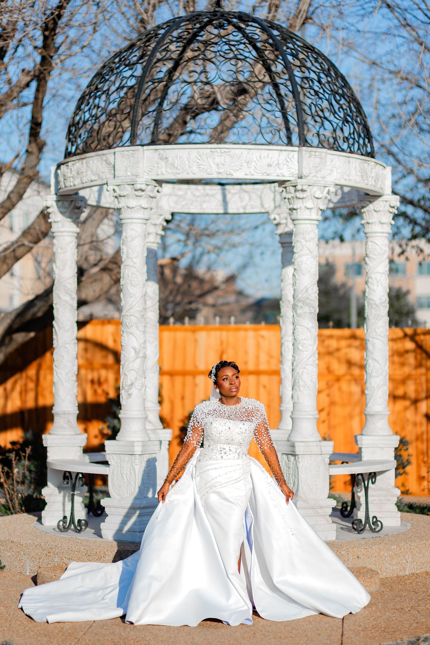 Romantic outdoor wedding portrait in natural garden setting.