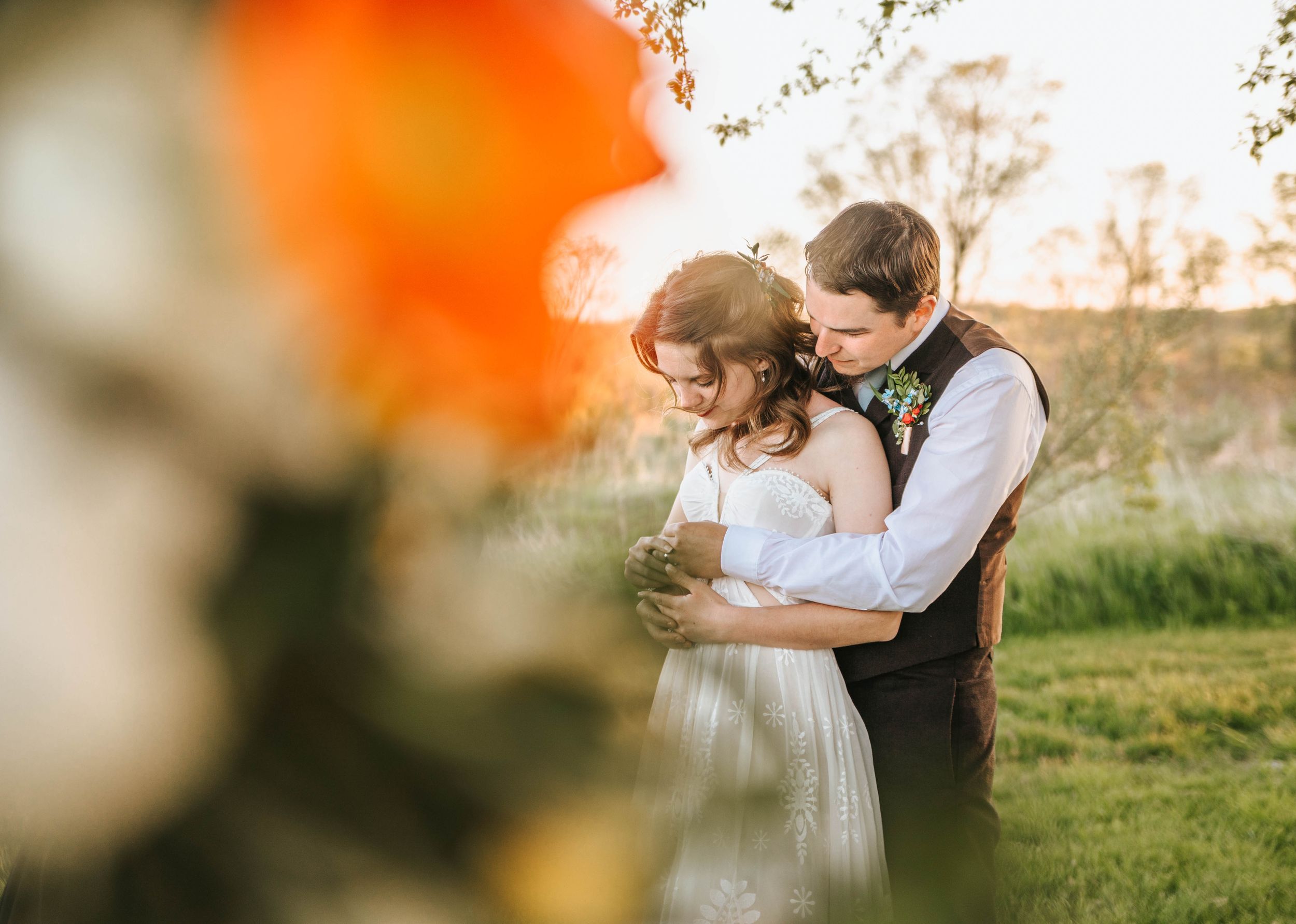 Romantic sunset portraits with soft orange bokeh and natural outdoor lighting.