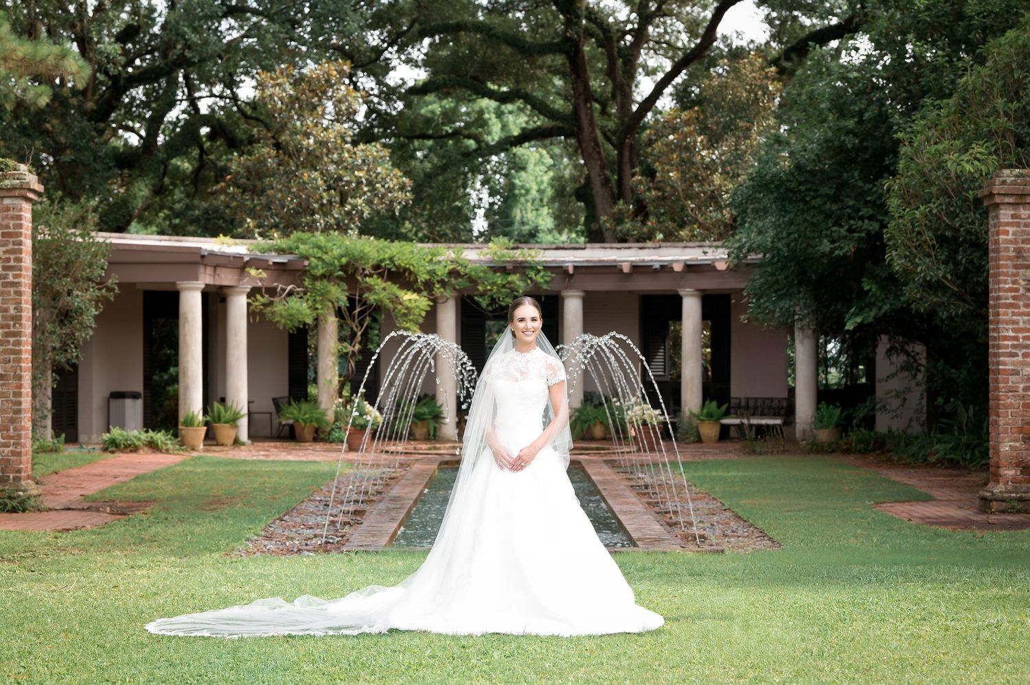 Wide landscape shots of a wedding ceremony setup on a manicured lawn with brick buildings.