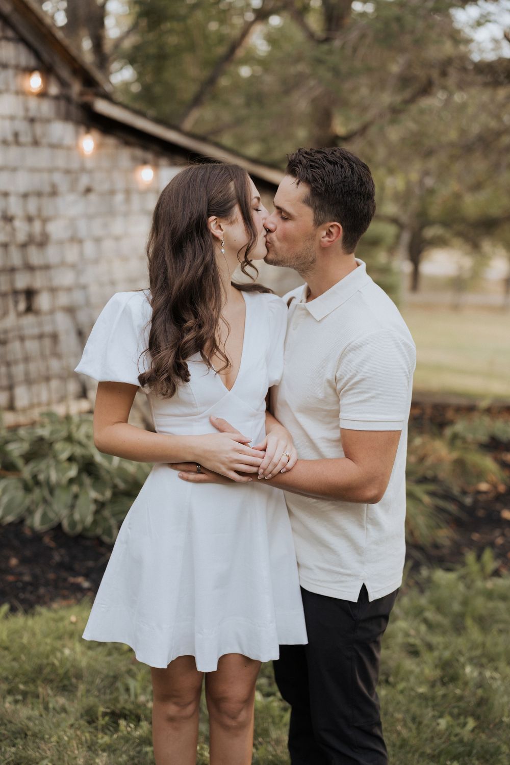 bride and groom kiss during romantic wedding portraits, outdoor engagement photos before surprise wedding, Moncton wedding photos Canada